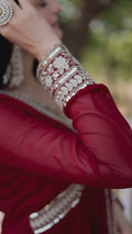 Model wearing a Wedding Wear Embroidered Maroon Alia Cut Gown with Dupatta, perfect for weddings and festive occasions