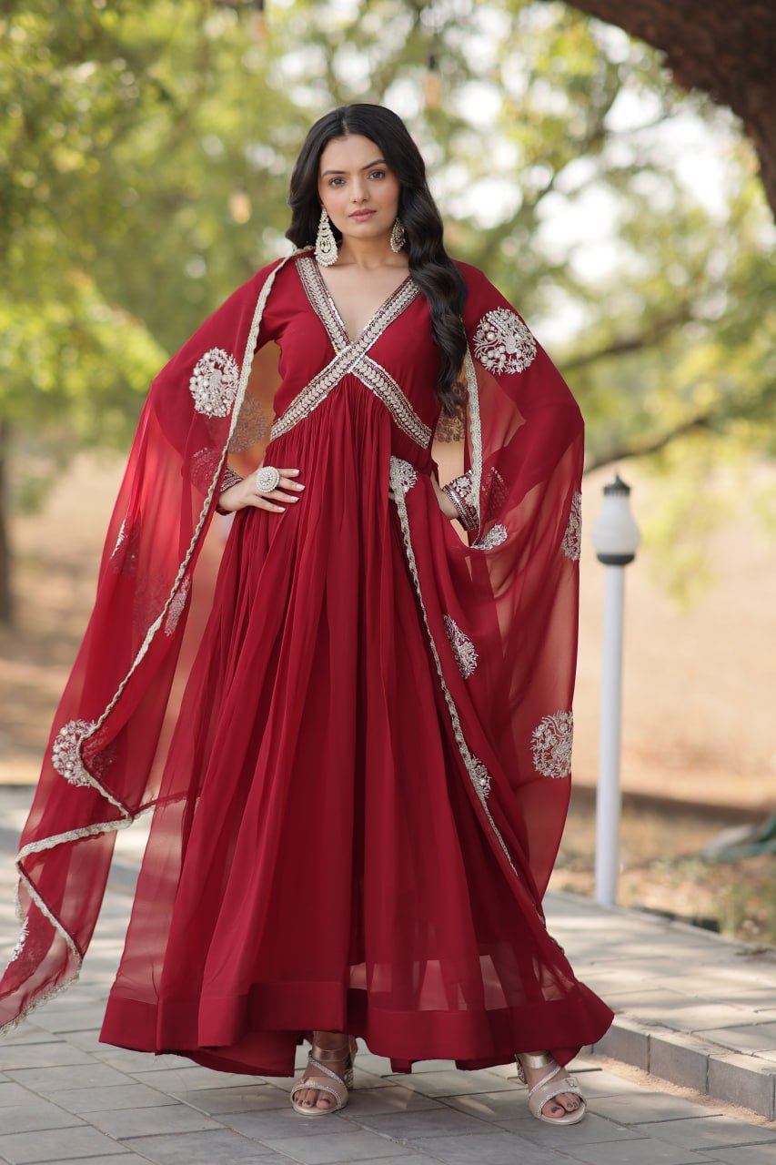 Model wearing a Wedding Wear Embroidered Maroon Alia Cut Gown with Dupatta, perfect for weddings and festive occasions