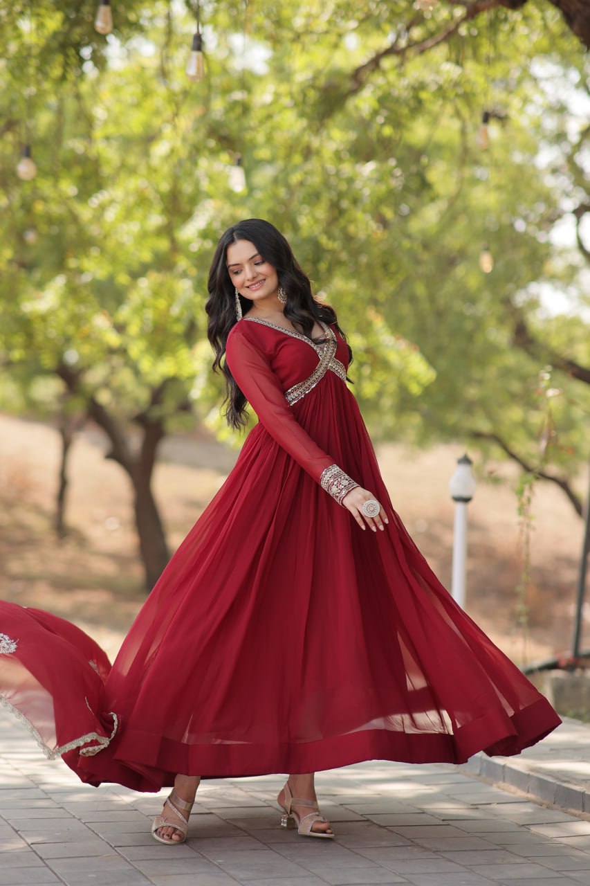 Model wearing a Wedding Wear Embroidered Maroon Alia Cut Gown with Dupatta, perfect for weddings and festive occasions