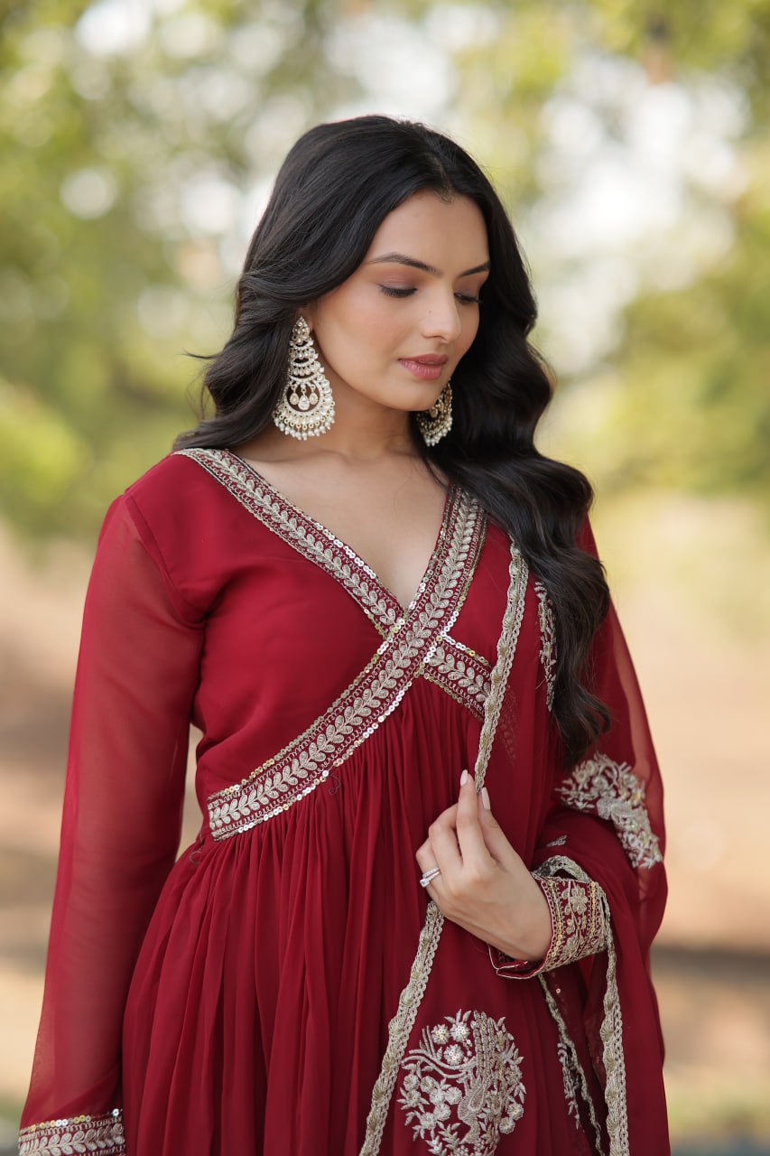 Model wearing a Wedding Wear Embroidered Maroon Alia Cut Gown with Dupatta, perfect for weddings and festive occasions