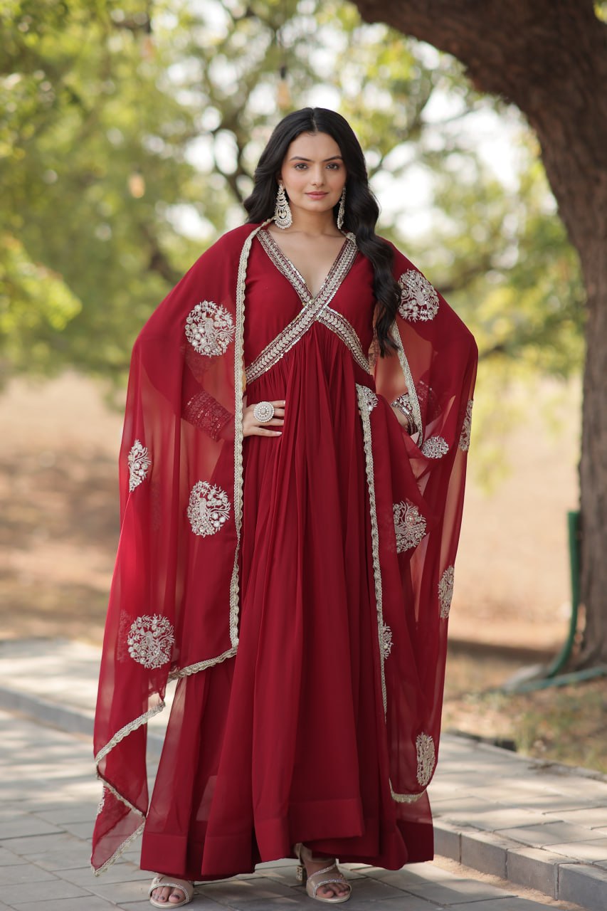 Model wearing a Wedding Wear Embroidered Maroon Alia Cut Gown with Dupatta, perfect for weddings and festive occasions